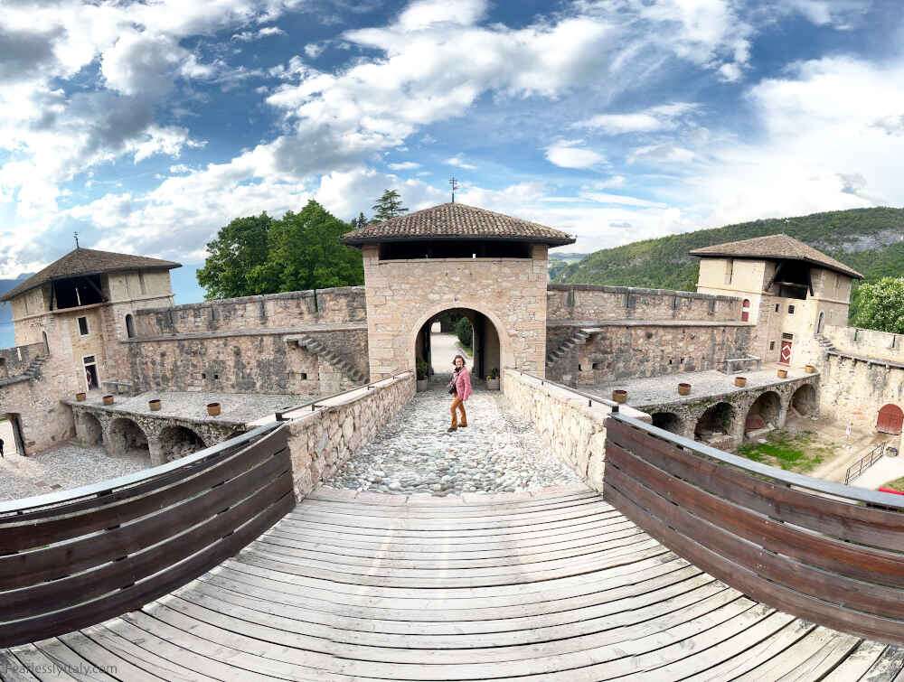 Image: Angela Corrias in Castel Thun, one of the best day trips from Trento. Photo by Fearlessly Italy