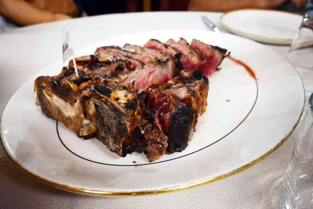 Image: Bistecca alla fiorentina in one of the best Florence restaurants for first-time visitors.