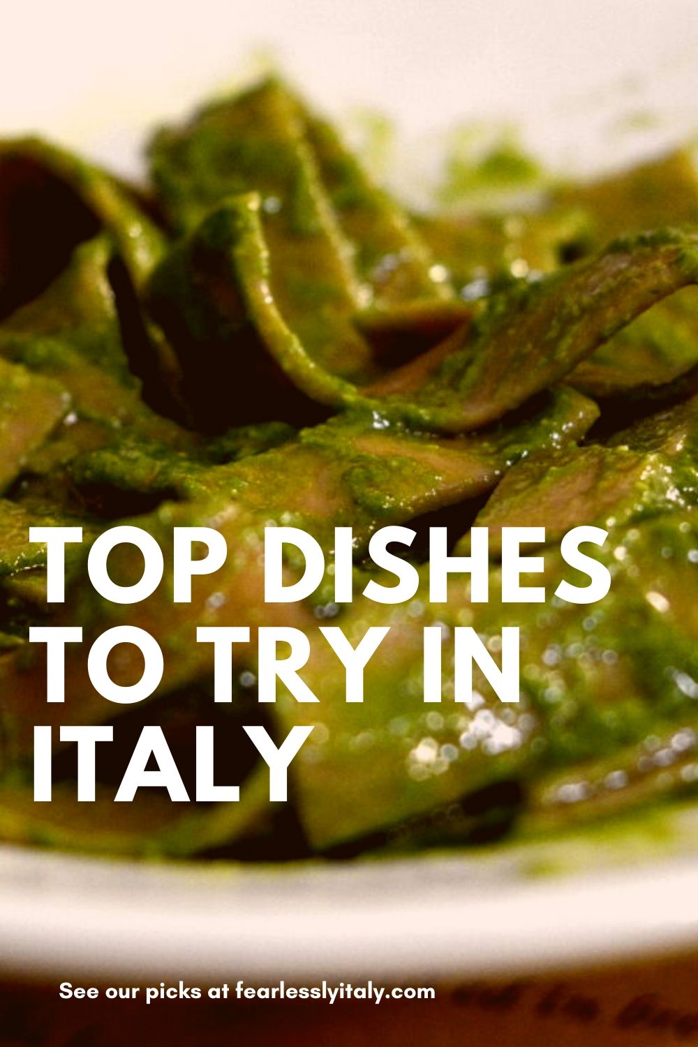 Pinterest image: Image of tagliatelle al pesto Italian dish with overlay caption reading "Top dishes to tray in Italy"